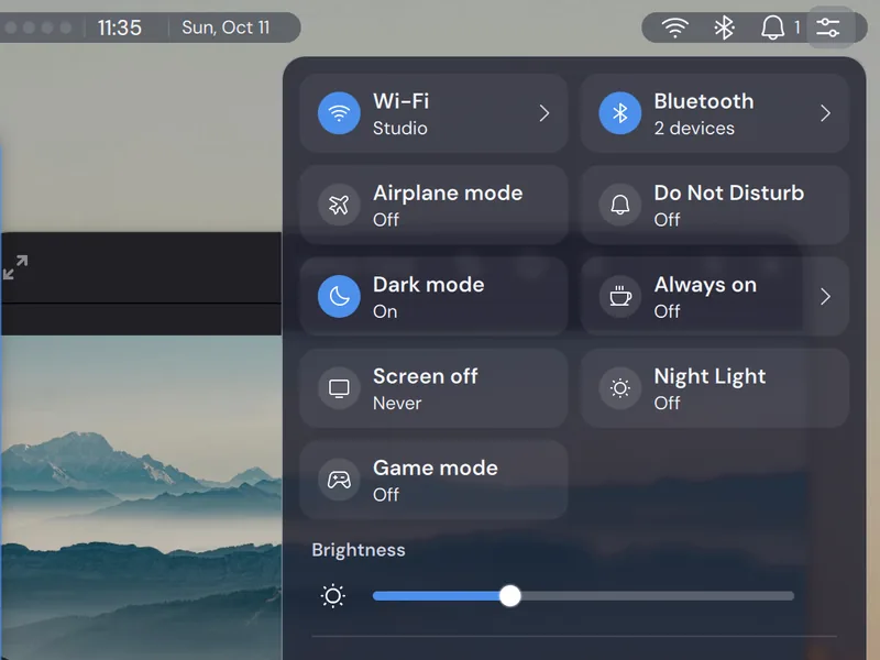 The Control Center at the standard transparency level, over open windows.