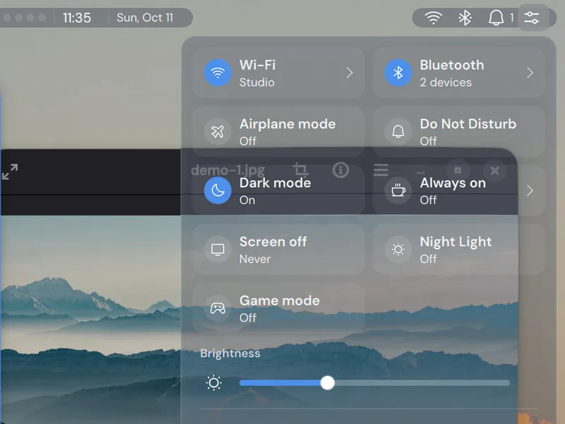 The Control Center at the highest transparency level, over open windows.