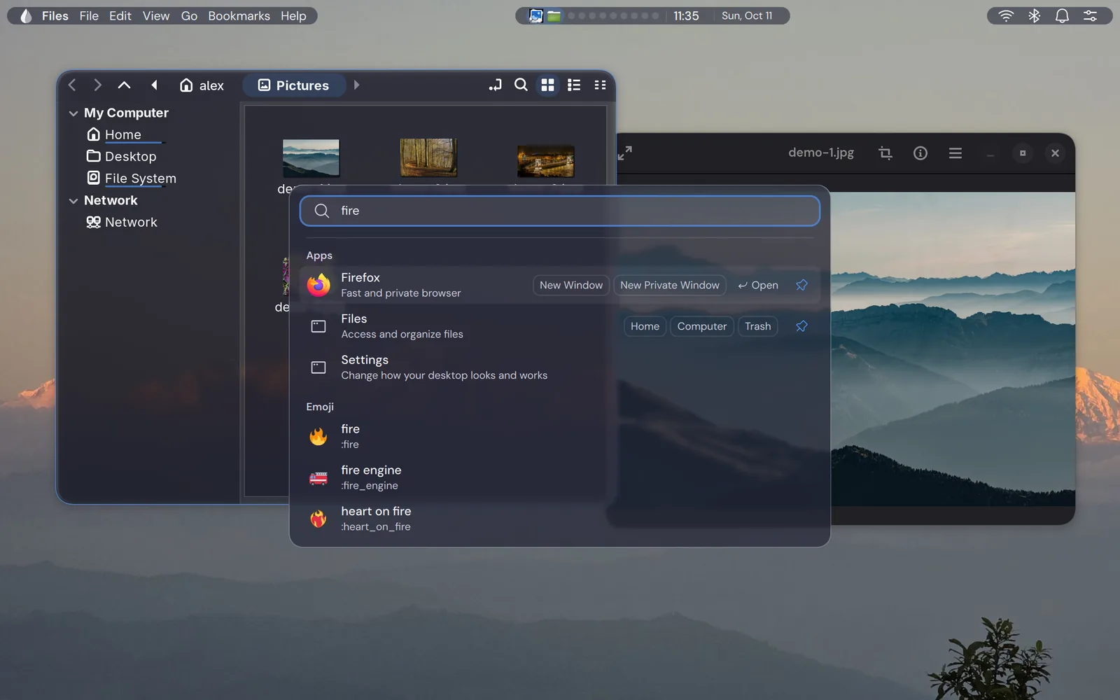 The launcher open over two windows, with apps and emoji.
